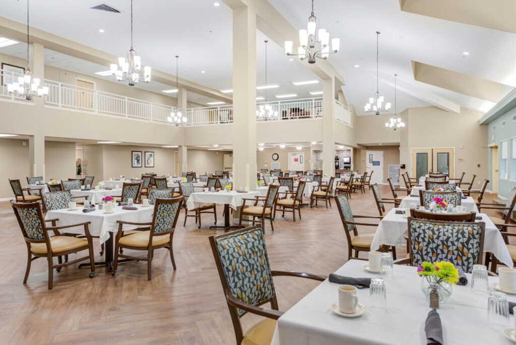 8440-South-Military-Trail-Boynton-Beach-FL-33436-USA_20220810_006-Copy - Windward Palms Spacious restaurant-style dining area ceiling with elegant lighting at Windward Palms, a premier senior living community near Boynton Beach.
