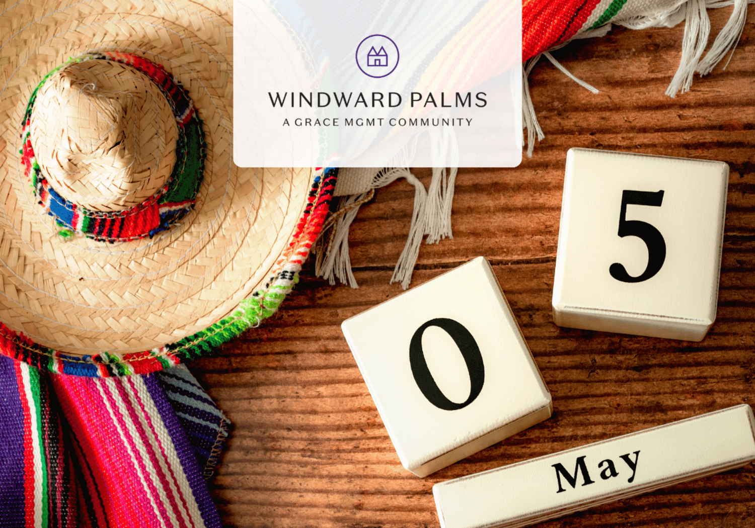 Straw hat with colorful woven trim on a wooden surface, beside May calendar blocks and the Windward Palms logo overlay.